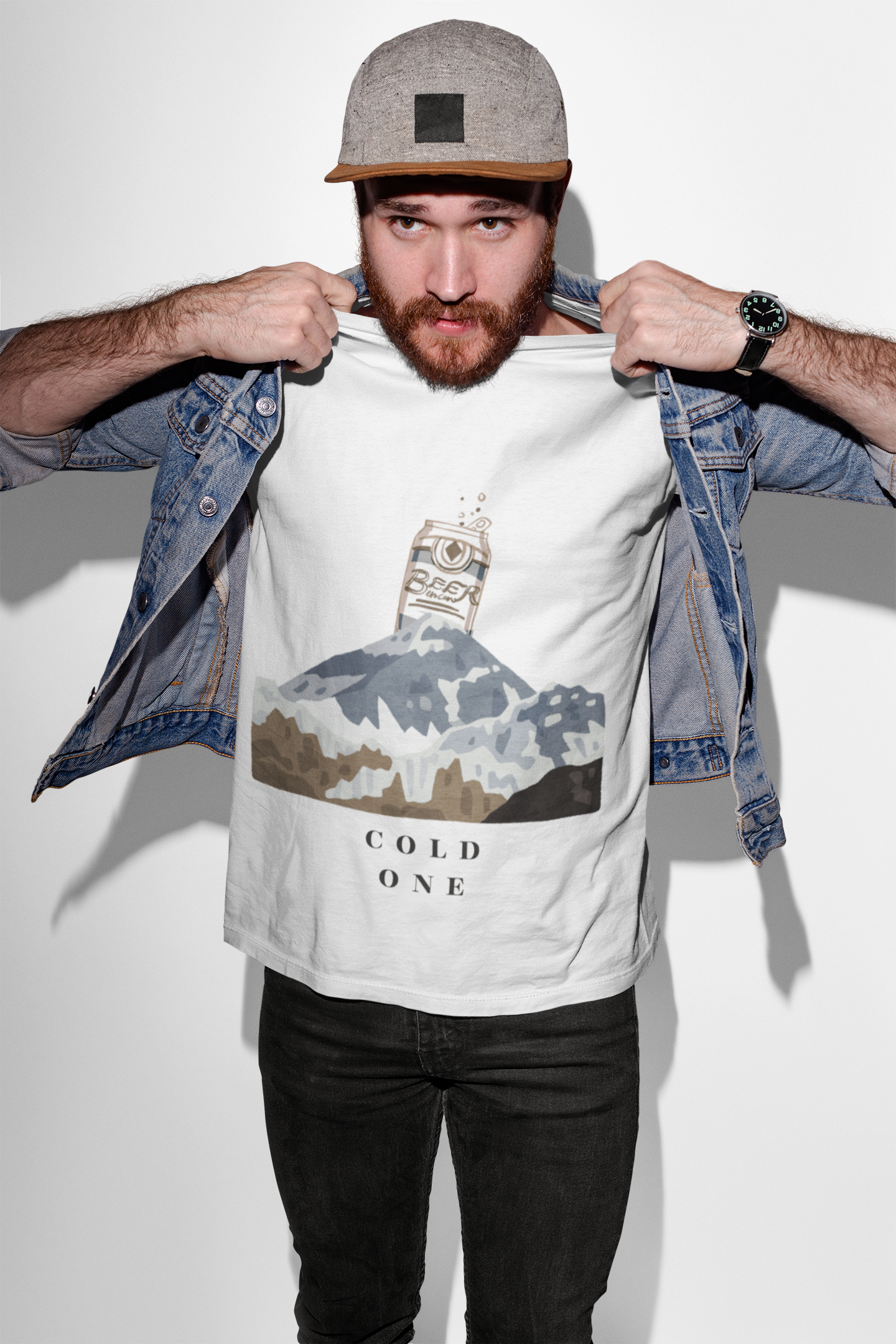 Man wearing a t-shirt with a graphic design and text, standing against a plain background