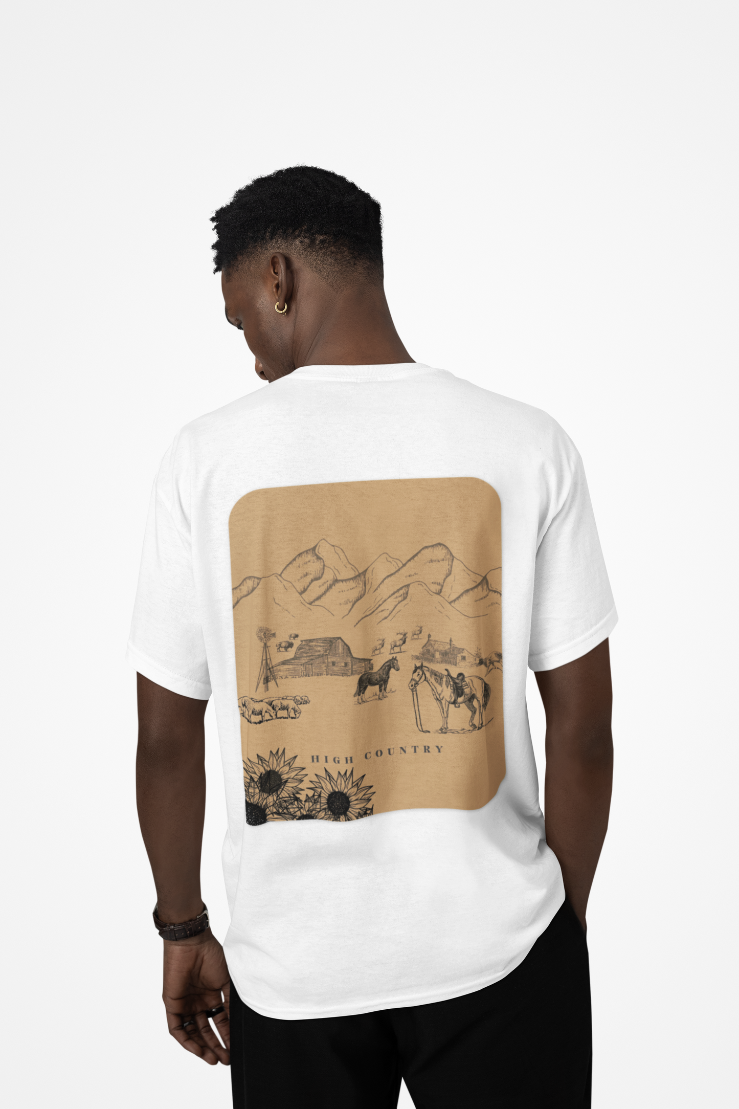 Person wearing a white t-shirt with a brown graphic on the back, standing against a white background