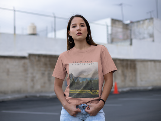 Woman wearing a t-shirt with a national park graphic in an outdoor setting