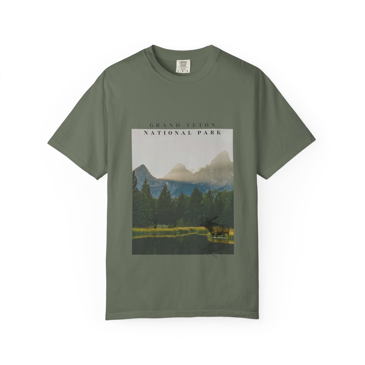 Green t-shirt with a graphic of Grand Teton National Park on a white background