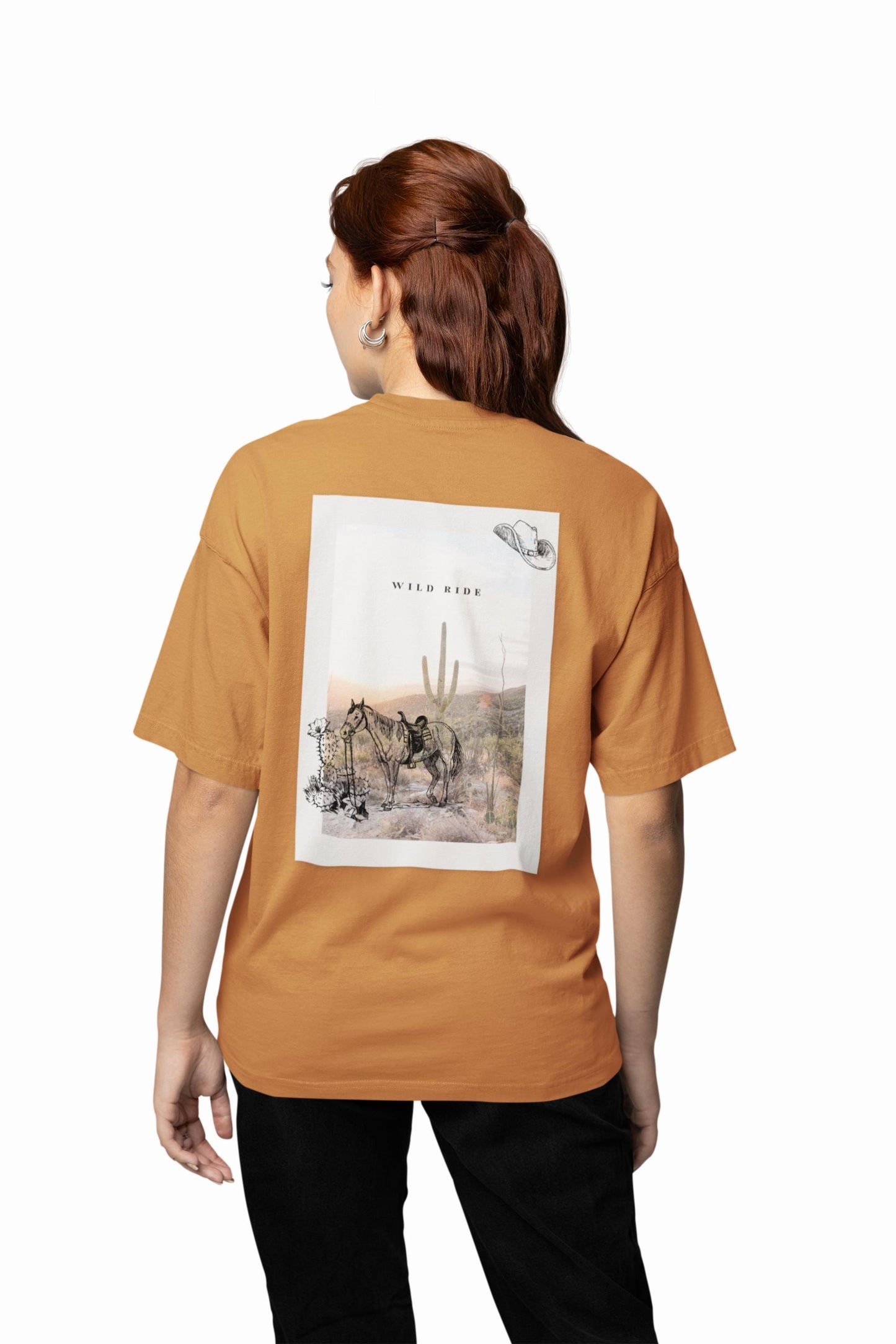 Person wearing a brown t-shirt with a graphic design on the back, standing against a white background